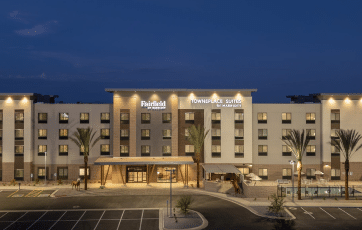 Townplace & Fairfield Suites by Marriott exterior at dusk